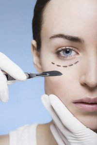 young woman with marks on her face gets surgery